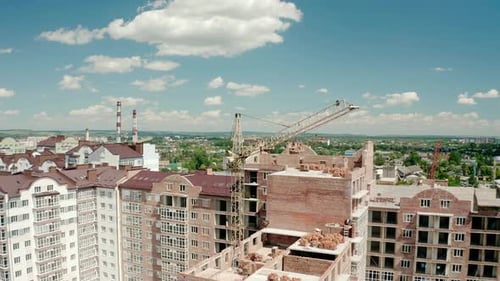 Aerial Drone View of Construction Building in City. Workers Work on Construction Sites Top View
