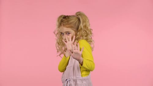 Little Cute Blond Girl Is Scared and Hiding