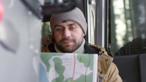 Traveler Holding Map and Looking Around
