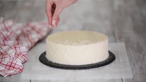 Decorating Coconut Cake with Delicate White Frosting