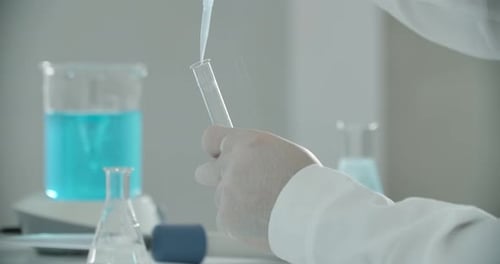 Liquid Being Added to Test Tube in Lab