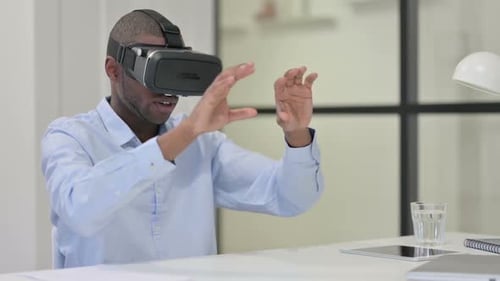 Young Adult Engaged in Virtual Reality in Office