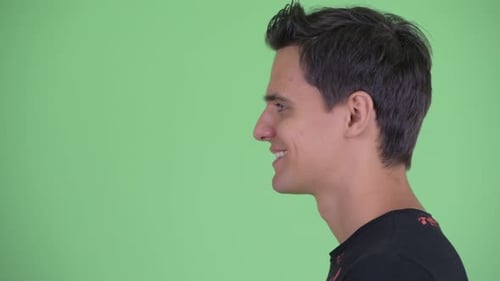 Closeup Profile View of Happy Young Handsome Man Smiling
