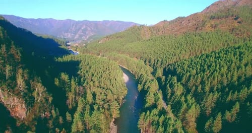 Low Altitude Flight Over Fresh Fast Mountain River with Rocks at Sunny Summer Morning.