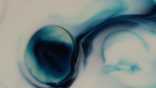Abstract Blue Ink Flowing in White Liquid