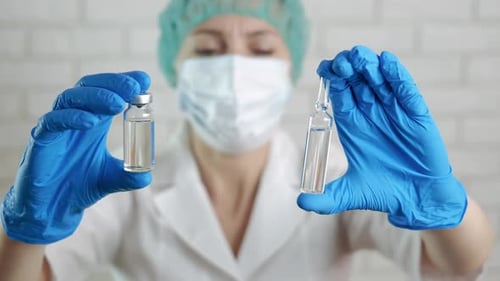 Doctor with a vaccine.