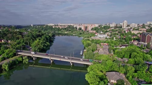 Skyline of Small Town River and Bridge