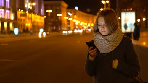 Woman on Phone at Night in City