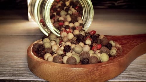 Macro Shot of Mixed Peppercorns Spilling