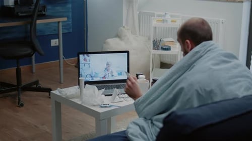 Adult Home Telehealth Consultation on Laptop