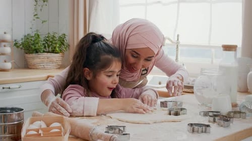 Muslim Mother And Daughter Cooking Cookies Using Baking Forms Indoor