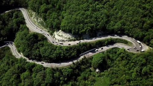 Fly Over Curved Winding Road Trough the Mountains