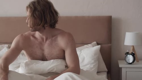 Man Wakes Up Unenthusiastically to Alarm Clock