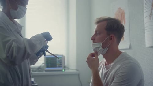 Professional Medic Taking Sample From Man Nose Closeup