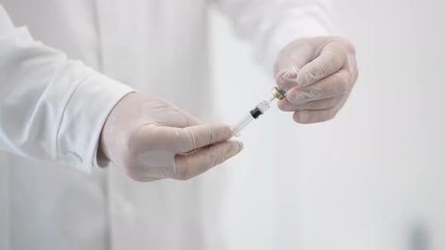 Drawing Medicine into Syringe from Vial