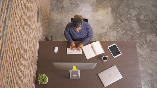 Top view of smiling African American business woman, black person working from home