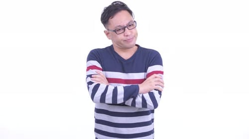 Man With Arms Crossed Looks Angry and Upset