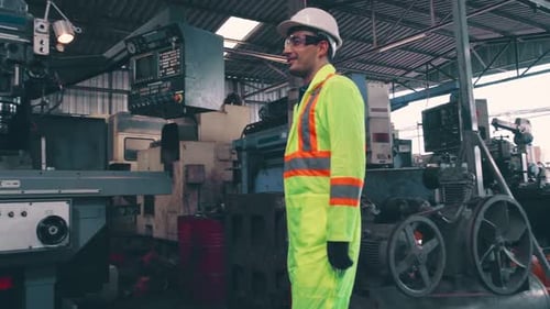 Factory Workers Handshake with Team Member in the Factory