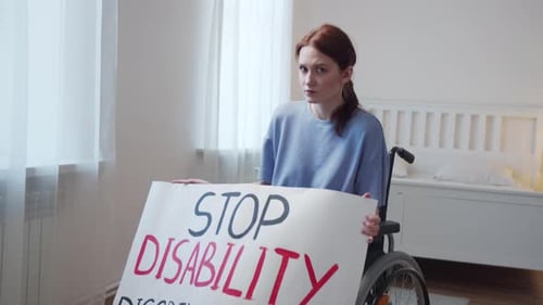 Woman in Wheelchair Protests Disability Discrimination