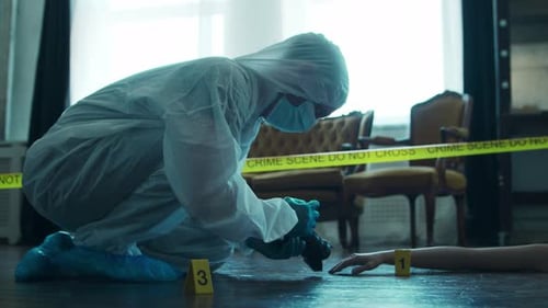 Crime Scene Forensic Investigator Photographing Evidence Indoors