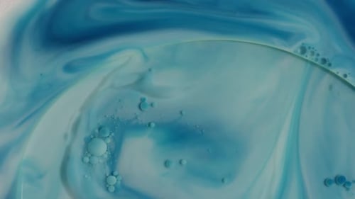 Swirling Blue and White Paint Creates Abstract Backdrop