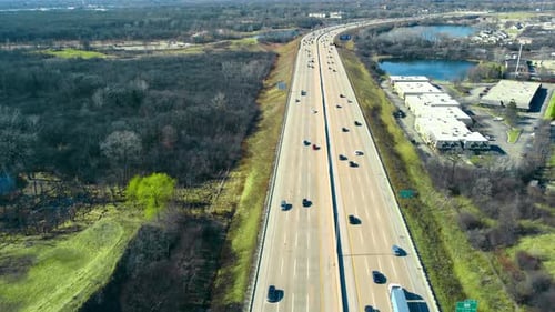 Flight Over the Highway and Car Traffic Moving in the Direction of the Big City