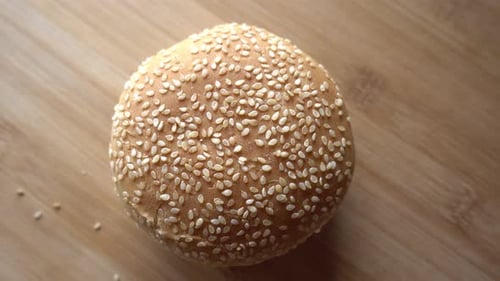 Delicious Sesame Seed Burger Bun on Wood