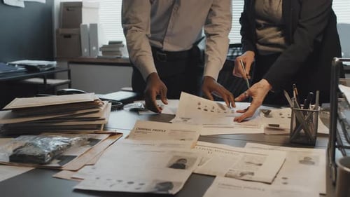 Detectives Collaborate Investigating at a Crime Scene