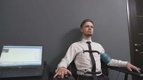 Man Taking Lie Detector Test in Office Setting