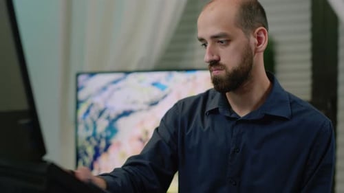 Digital Artist Working at Home on Tablet