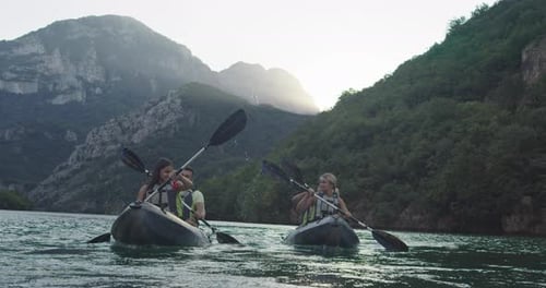 Couples Kayaking in Mountain River Adventure