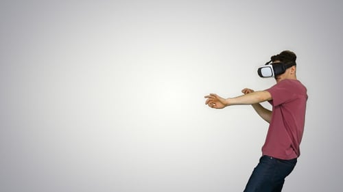Man Experiencing Virtual Reality Using Headset