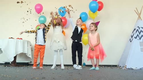 Children Celebrate Birthday with Confetti and Balloons