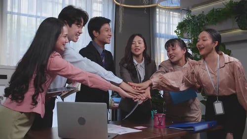 Teamwork Celebration in Office Setting