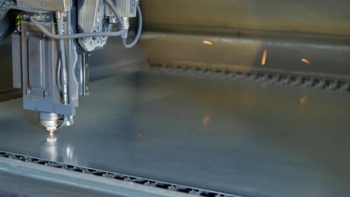 Robotic Arm Cutting Metal Sheet with Sparks