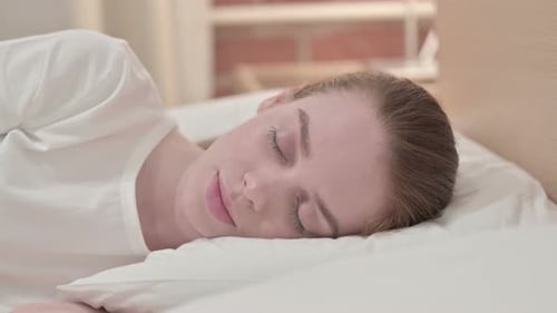 Woman Sleeping Peacefully in Bed Close-Up
