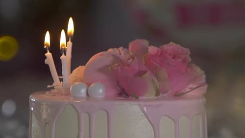 Elegant Birthday Cake with Candles and Pink Roses