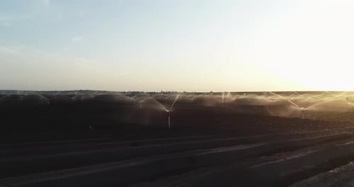Aerial View Irrigation Sprinklers In The Field. Watering The Field