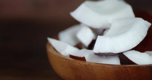 Fresh Coconut Chunks Inside Wooden Bowl