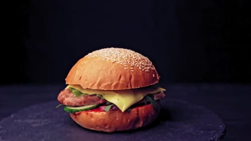 Delicious Burger with Cheese, Lettuce, and Cucumber