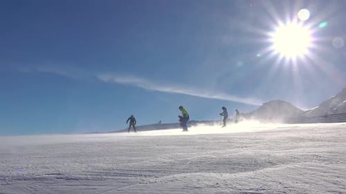 Skiers Enjoying a Sunny Winter Day on Mountain