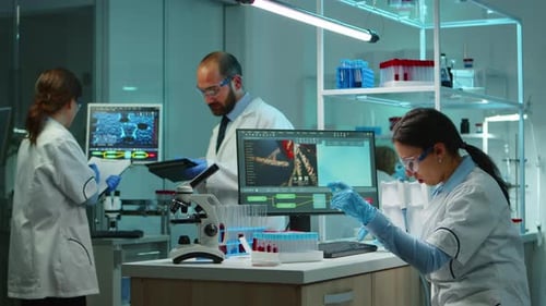 Medical Researchers Working Together in Modern Laboratory