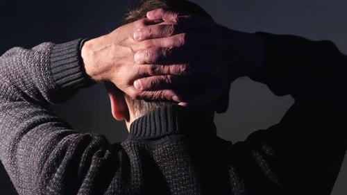 Adult Puts Hands Behind Head Close Up