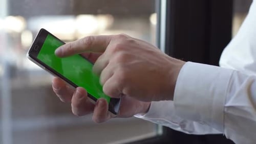 Businessman Using Phone with Green Screen