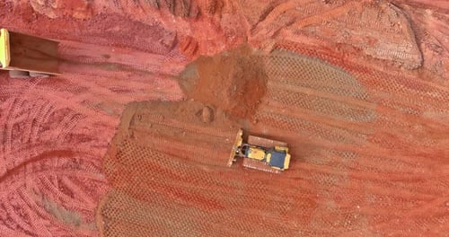 Aerial View of Bulldozer and Tractor Moving Earth