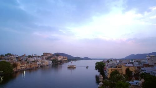 Evening view of Udaipur city skyline and lake Pichola time lapse.