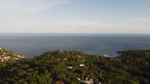 Hills Along Coast Into The Water