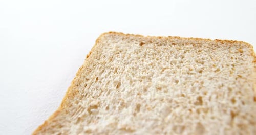 Slice of Wheat Bread on White Background
