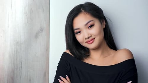 Attractive Young Woman Posing with Black Hair