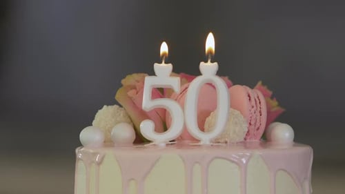 Decorated Birthday Cake with Candles and Macaroons